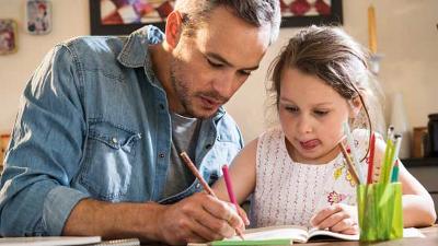 Man and girl doing homework